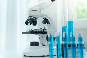 analyze biochemical sample in advanced scientific laboratory. Medical professional use microscope look microbiological developmental of viral. Biotechnology research in science lab. photo