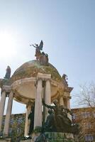 Monument with Bronze Statues and Domed Colonnade in Liverpool, UK. photo