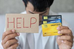 Stressed and headache man with large bills or invoices no money to pay to expenses and credit card debt. shortage, Financial problem, bankruptcy, mortgage, loan, bankrupt, poor, photo