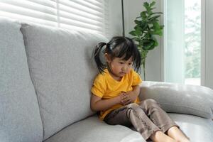 girl children have abdominal pain, indigestion, gastritis, menstrual cramps, flatulence, diarrhea, distention, colon cancer, belly inflammation problem, suffer food poisoning, abdomen photo