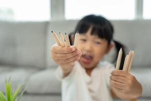girl show pint, Happy children playing learn paint on paper. Activity, development, IQ, EQ, meditation, brain, muscles, essential skills, family having fun spending time together. photo