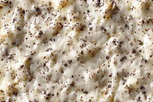 Cream with chocolate crumbs as a background. Macro. photo