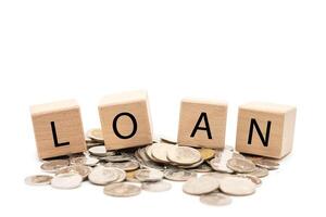 Loan Concept with Wooden Blocks and Coins Isolated on White Background. Financial Planning and Money Lending Idea. photo