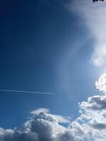 Blue sky background with clouds sun and plain print summer sunny day photo