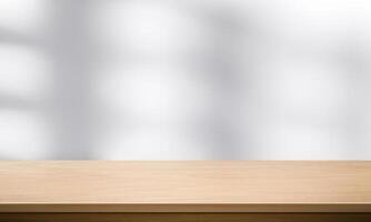 Wood table top and blurred wall shadow leaves window background can used for display or montage your products15 photo