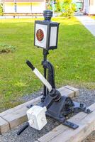 A light pole with a light on it photo