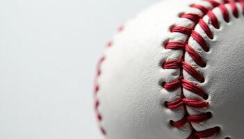 A close up of a baseball with red stitching photo