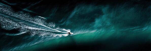Aerial view of a jet ski rider in the ocean photo
