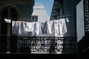 White clothes hanging on a clothesline photo