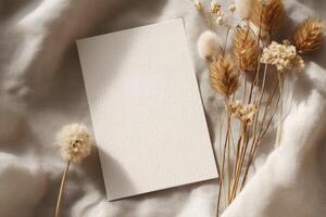 Blank card on a bed with dried grass photo