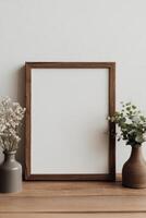 Mock up of a wooden frame on a table with flowers photo