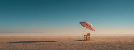 A chair and umbrella in the middle of a desert photo