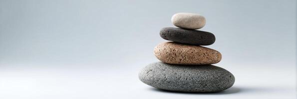 A stack of rocks on a gray background photo
