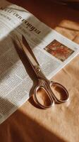 A pair of scissors on a newspaper photo