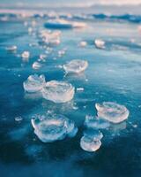 Ice cubes floating on the surface of the water photo