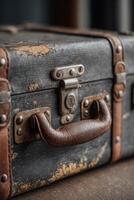 An old suitcase sitting on a table photo