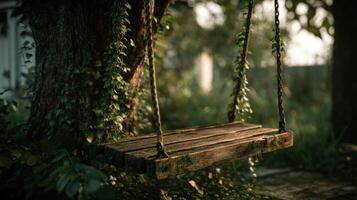 A wooden swing sitting on a tree in the middle of a forest photo