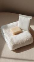 A towel with soap and a bag of soap photo