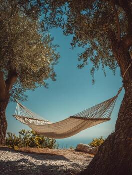 A hammock is hanging between two trees photo