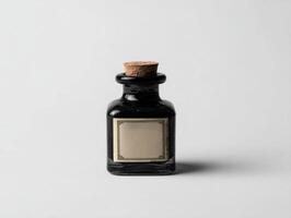 A black bottle with a cork on top photo