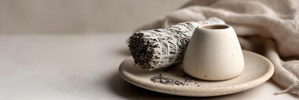 A white vase with a small bowl of herbs photo