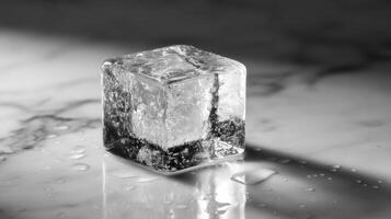 Ice cube on marble surface with water droplets photo
