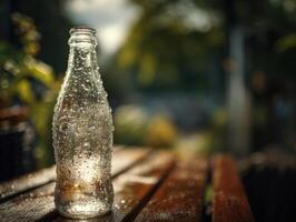A bottle of coke sitting on a wooden table photo