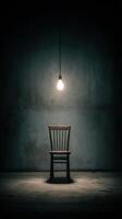 A chair sitting in an empty room with a light bulb photo