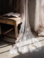 A chair and an open book on a window sill photo