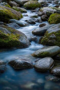 A stream of water flowing over rocks photo