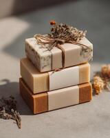 Three soap bars wrapped in twine photo