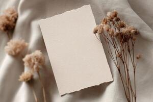 Blank paper on a bed with dried flowers photo