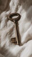 A key is sitting on a bed photo