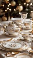 Elegant holiday table setting with gold-trimmed china and crystal glassware photo