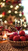 Festive holiday table setting with red ornaments and sparkling wine photo
