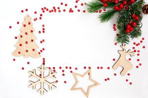 Christmas flat composition on a white table in the form of a frame photo