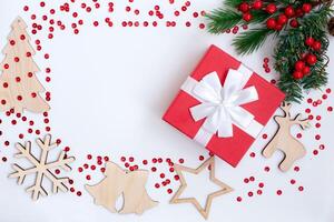 Christmas composition on a white table in the form of a frame photo
