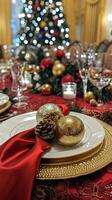 Elegant christmas dinner setting with festive decorations and glowing tree photo