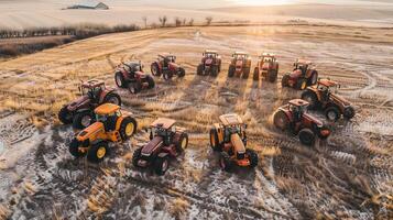 Sunrise gathering of modern tractors in a rural field photo