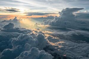 Overhead view of a massive cloud deck illuminated by low sunlight during dusk photo