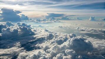 Overhead view of endless flat sheet of clouds against a vibrant sky during daylight hours photo