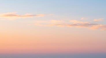 A man is standing on a hill with a plane in the background photo
