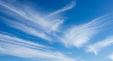 Bright Blue Sky with Cirrus Clouds photo