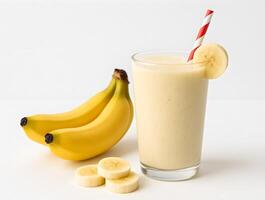 A glass of banana smoothie with bananas and a banana peel photo