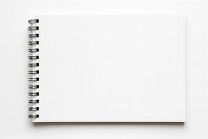 An open notebook with a blank page on a white background photo