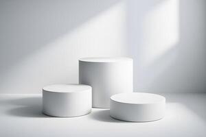 Three white pedestals on a white surface photo