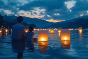 a family releasing floating lanterns into the sea at dusk during Obon, warm light from the lanterns reflecting on the calm water, mountains in the distance photo