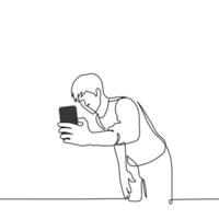 man leaning over holding phone taking selfie with something in the background - one line art . concept of selfie with object or landscape vector
