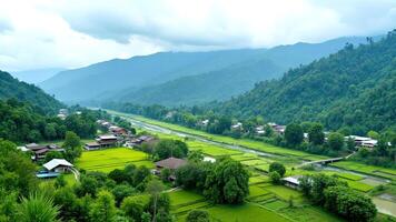 Serene Mountain Landscape with Lush Green Fields and Tranquil River photo
