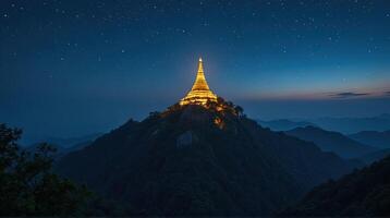 Serene Mountain Temple Illuminated Under Starry Night Sky photo